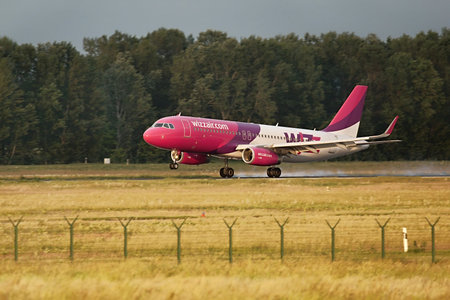 BUDAPEST, HUNGARY - MAY 5, 2014: Wizzair A320 landing at Budapest Liszt Ferenc Airport. Budapest is...