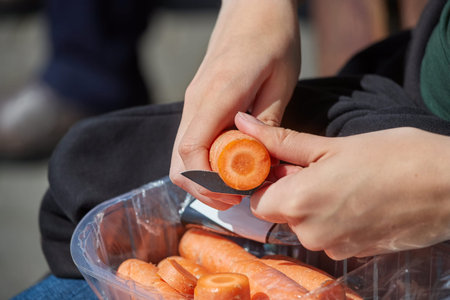 Cutting carrots with a knife