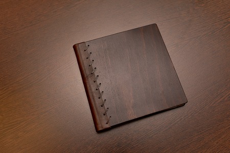 Note book with hard wooden coverの写真素材
