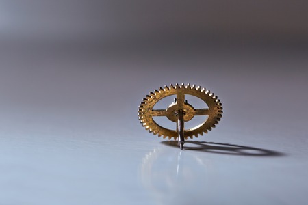 Clockwork cogwheel on a deskの写真素材