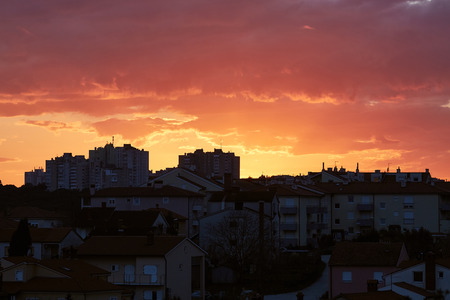 Sunset urban view, crimson skyの写真素材