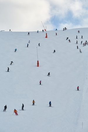 Skiing slopes with skiersの写真素材
