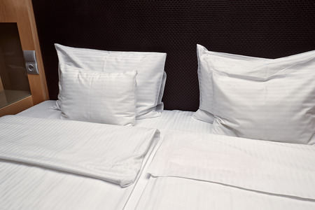 Hotel bed closeupの写真素材