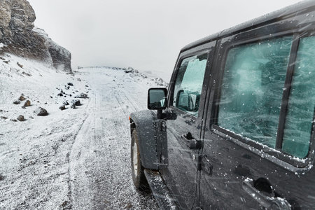 Car on Icelandic snowy terrain