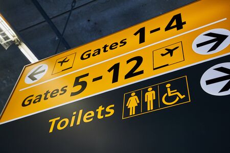 Toilet and gates signs showing directionの写真素材