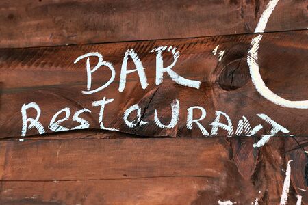Restaurant bar sign painted on wooden boardの写真素材