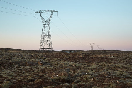 Electric lines through the rugged landscpe if Iceland