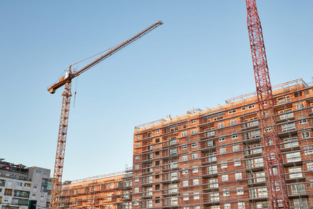 Apartment building block of flats under construction in a city urban area, brick building