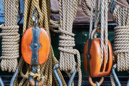 Old sailing ship rigging details, ropes and pulleysの写真素材