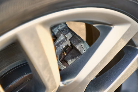 Wheel of modern SUV vehicle, break caliper and rotor, car detail closeupの写真素材
