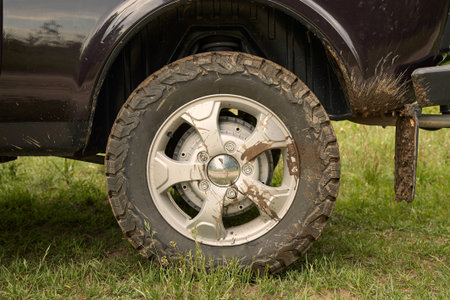 Rear wheel of a 4x4 vehicle dirty with mud