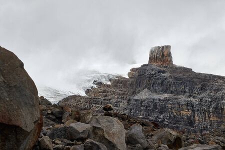 High mountain landscape with rough snowy cliffs, clouds passing by in the Andes, Sierra Nevada del Cocuy, Pulpito del Diablo, the Devil's Pulpitの写真素材