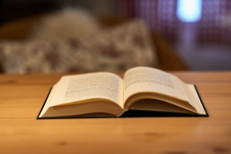 Open book on a table with shallow DoFの写真素材