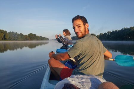Canoe tour on a riverの写真素材