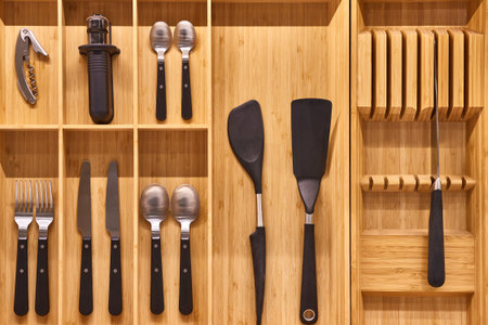 Minimalist kitchen tools put away in a drawer
