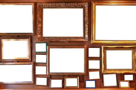 Blank picture frames on a wall gallery
