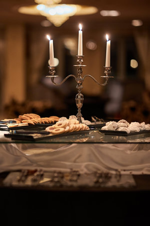 Candles and cookies in an elegant saloon