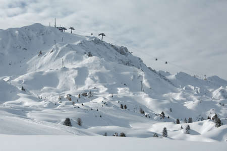 Mountain skiing slopes, snowy Alpine landscapeの写真素材