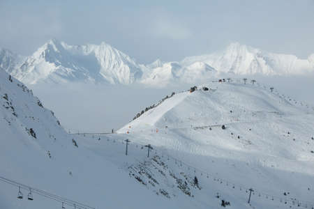 Snowy skiing slopes from the topの写真素材