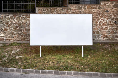 Empty singboard by a roadの写真素材