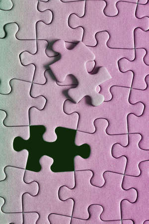 Jigsaw puzzle background, almost doneの写真素材