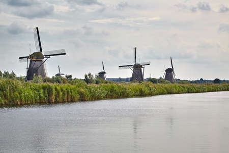 Windmill beside a canalの写真素材