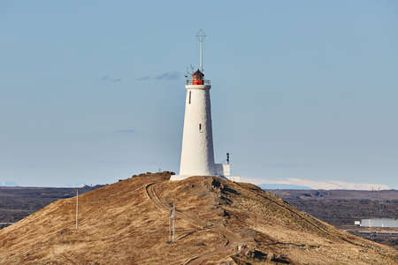 Old White Lighthouse on a hillの写真素材