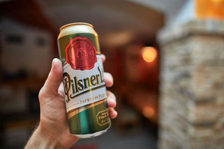 Holding beer in a houseのeditorial素材
