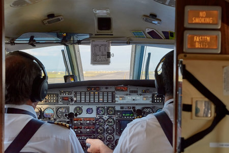 Controlling a small aircraft in the flight deckの写真素材