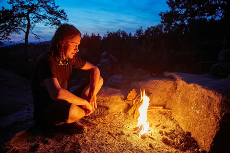 Man by a campfireの写真素材