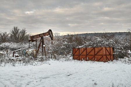 Oil well on a winter landscapeの写真素材