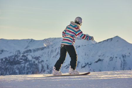 Female snowboarder in the Alpsの写真素材