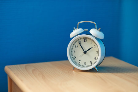 Alarm Clock on a Shelfの写真素材