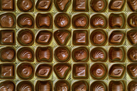 Open box of chocolate treetsの写真素材