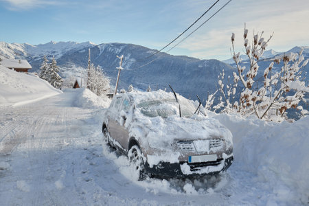 Winter road and snowy carの写真素材