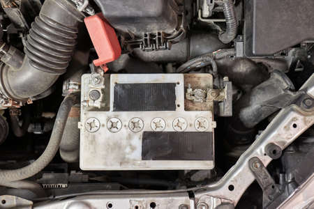 Old starter battery in a carの写真素材