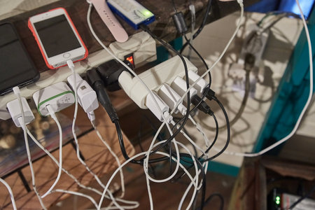 Charging phones and other devices in a messのeditorial素材