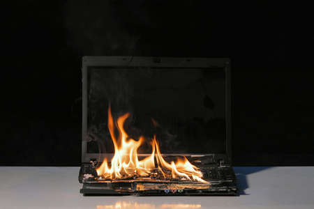 Burning laptop computerの写真素材
