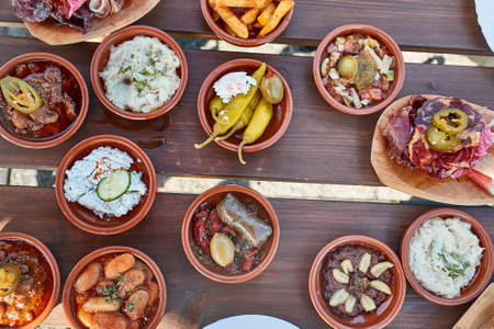Tapas served in many small platesの写真素材