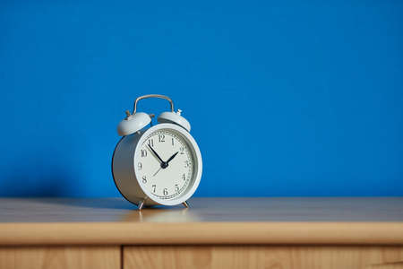 Alarm Clock on a Shelfの写真素材
