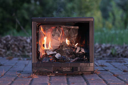 TV burning with broken screenの写真素材