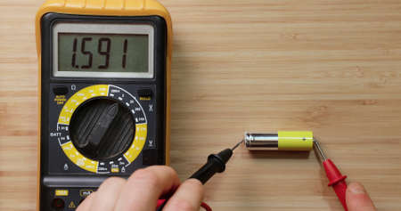 AA battery cell voltage checkingの写真素材