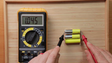 AA battery cells voltage checkingの写真素材