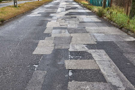 Patched broken roadの写真素材