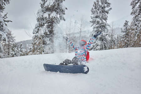 Snowboarder having a restの写真素材