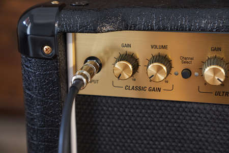 Guitar amplifier closeup, cable connectedの写真素材