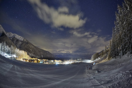 Ski slopes at night under the stars in the skyの写真素材