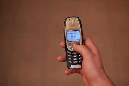 Setting alarm on old cellphone, Nokia 6310iのeditorial素材
