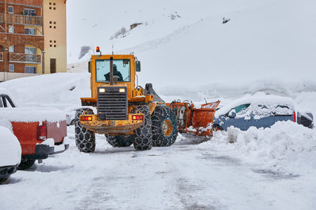 Winter road clearing snowplowの写真素材