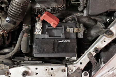 Old starter battery in a carの写真素材